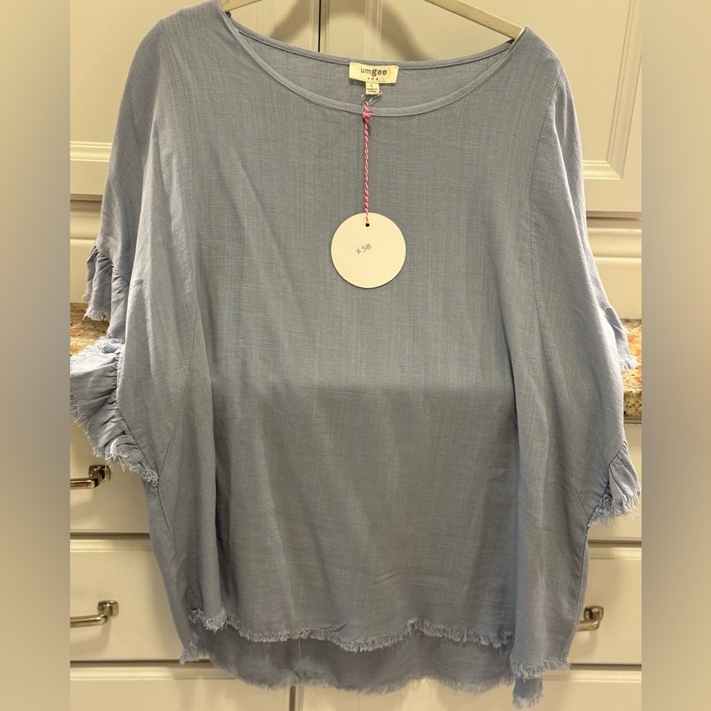 Umgee Large Top with raw edge hems and raw edge sleeves light blue NWT